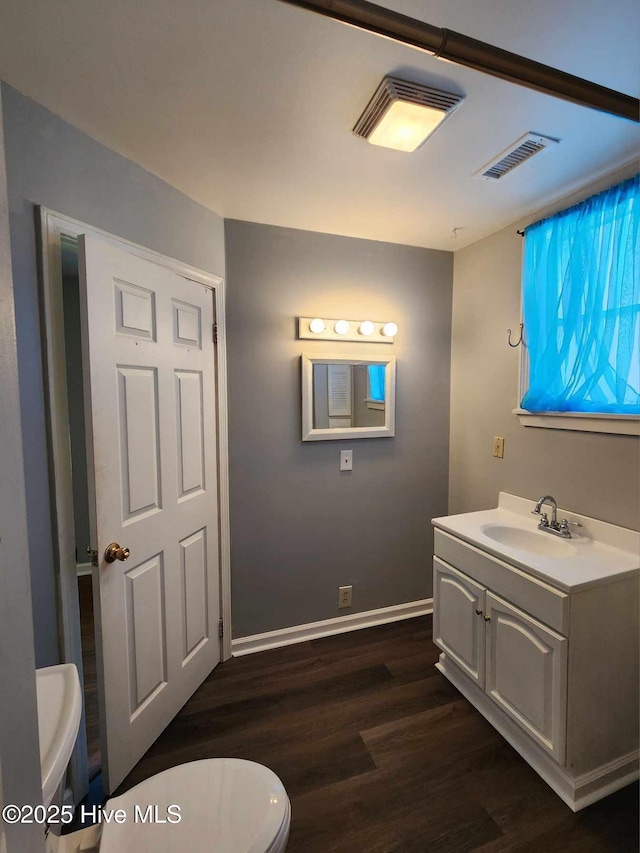 106 Hunters Trl E, Elizabeth City, NC 27909 - bathroom with visible vents, baseboards, toilet, wood finished floors, and vanity