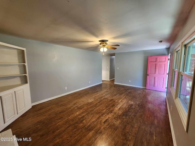 106 Hunters Trl E, Elizabeth City, NC 27909 - unfurnished living room featuring dark wood finished floors, baseboards, and ceiling fan