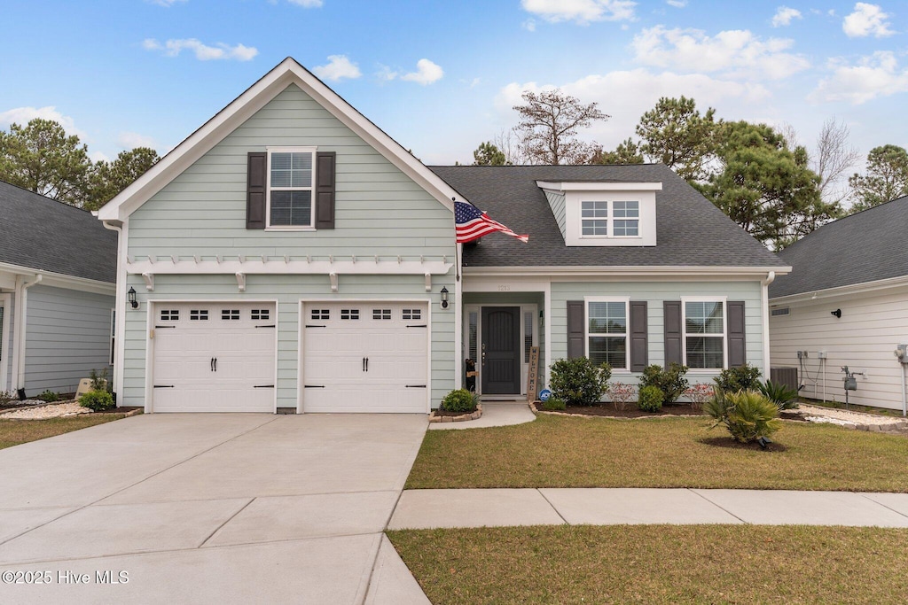 1213 Lt Congleton Rd, Wilmington, NC 28409 - traditional-style house with driveway, an attached garage, a shingled roof, and a front yard