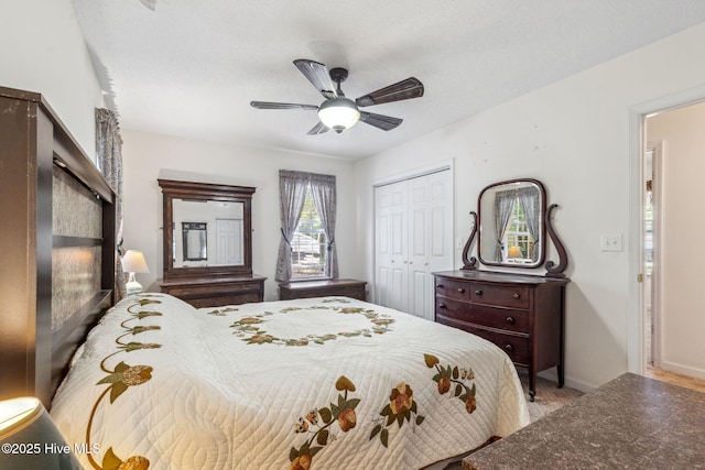 bedroom featuring a closet, a ceiling fan, and baseboards