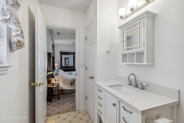 bathroom featuring vanity and ensuite bath