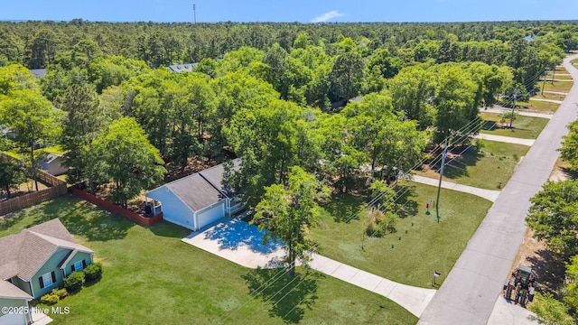 drone / aerial view featuring a view of trees