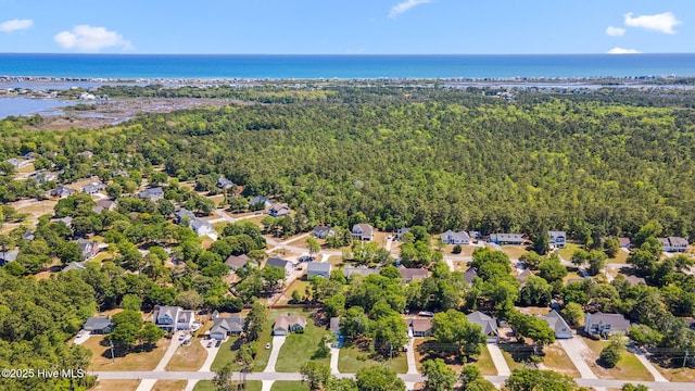 aerial view featuring a residential view, a water view, and a forest view