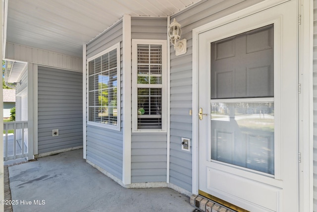 doorway to property featuring covered porch