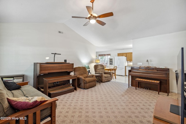 living room featuring a ceiling fan, light colored carpet, visible vents, and lofted ceiling