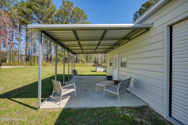2170 Ash Little River Rd NW, Ash, NC 28420 - view of front facade featuring an outdoor structure, a storage unit, a porch, and a front lawn