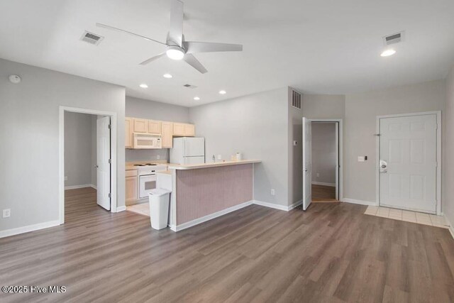 155 Royal Poste Rd # 3005, Sunset Beach, NC 28468 - kitchen featuring light brown cabinets, visible vents, a ceiling fan, and white appliances