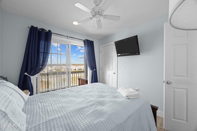 bedroom featuring a ceiling fan, baseboards, and access to exterior