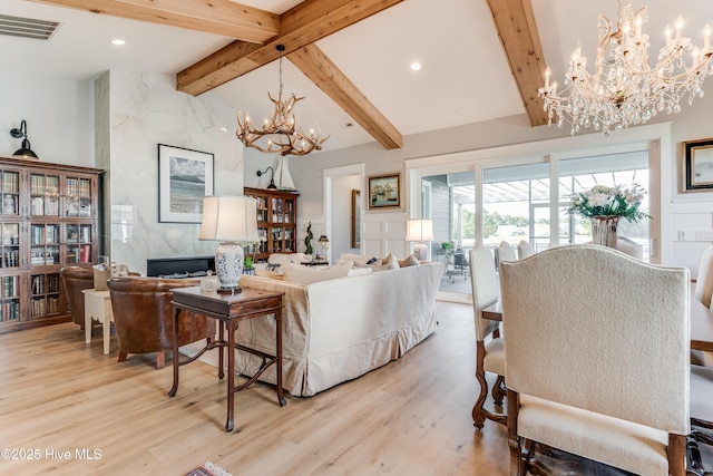 266 Twining Rose Ln, Holly Ridge, NC 28445 - living area featuring an inviting chandelier, recessed lighting, vaulted ceiling with beams, light wood-type flooring, and visible vents
