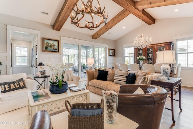 266 Twining Rose Ln, Holly Ridge, NC 28445 - living area featuring an inviting chandelier, light wood-style flooring, a decorative wall, and visible vents