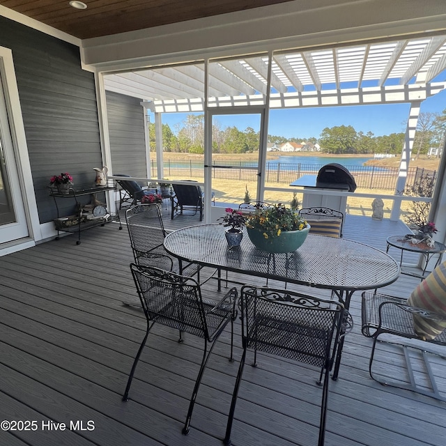 266 Twining Rose Ln, Holly Ridge, NC 28445 - deck featuring a water view, a pergola, and outdoor dining area