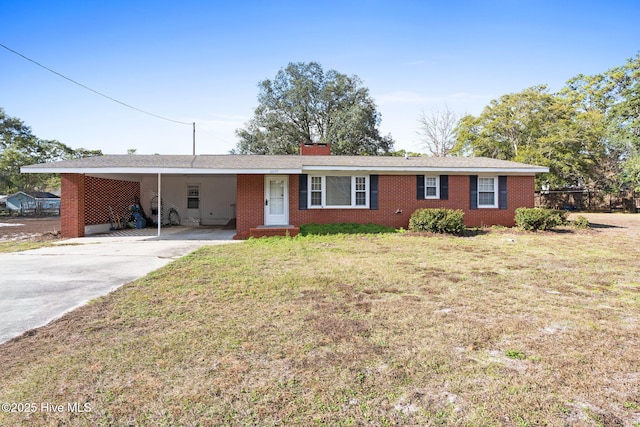 ranch-style home with a chimney, concrete driveway, a front yard, brick siding, and a carport