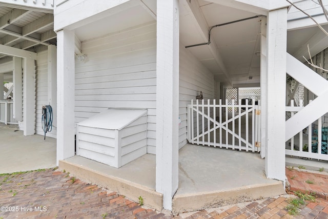 view of exterior entry featuring a gate