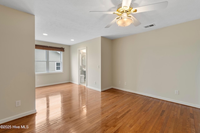 unfurnished room with light wood finished floors, baseboards, visible vents, ceiling fan, and recessed lighting