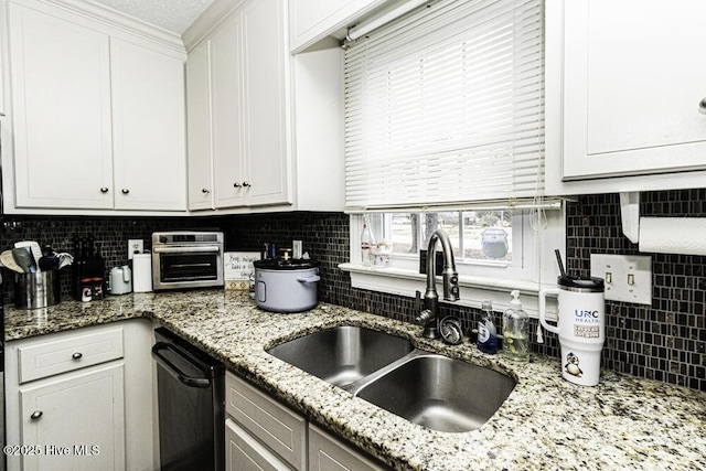 200 Emerson Dr, Rocky Mount, NC 27803 - kitchen featuring decorative backsplash, a sink, light stone counters, dishwasher, and white cabinets