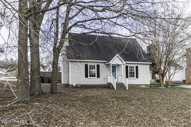 200 Emerson Dr, Rocky Mount, NC 27803 - new england style home with a shingled roof and fence