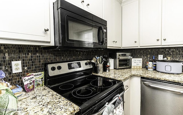 200 Emerson Dr, Rocky Mount, NC 27803 - kitchen featuring white cabinets, stainless steel appliances, light stone counters, and tasteful backsplash
