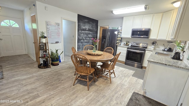 304 Mary Ave, Castle Hayne, NC 28429 - dining space featuring light wood-style flooring