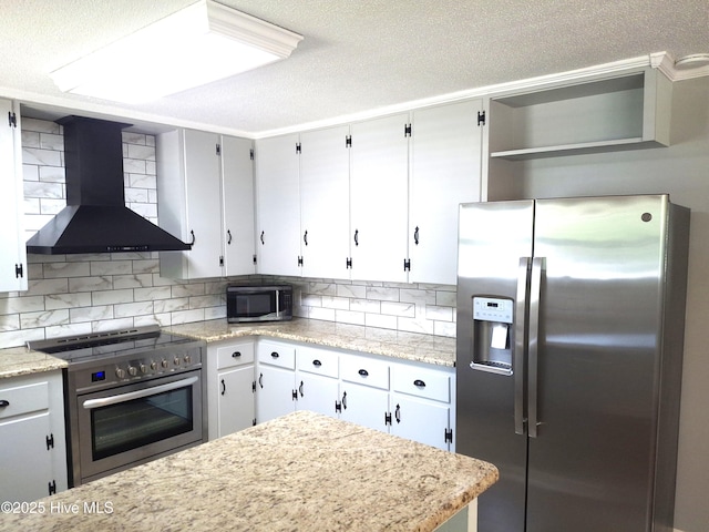 302 NE 60th St, Oak Island, NC 28465 - kitchen with stainless steel appliances, wall chimney exhaust hood, backsplash, open shelves, and a textured ceiling