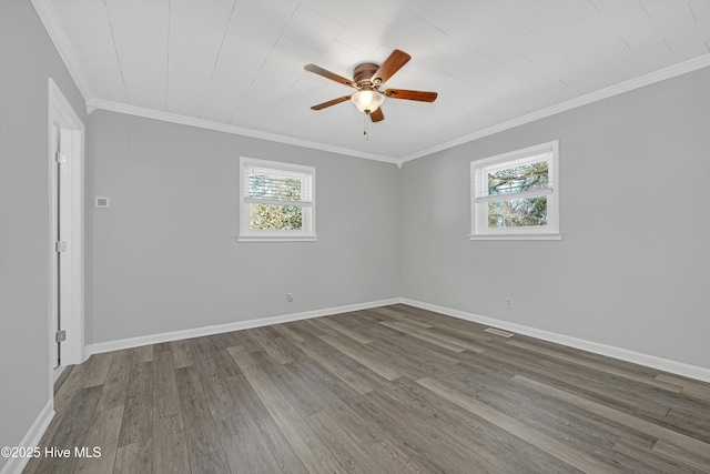 302 NE 60th St, Oak Island, NC 28465 - empty room featuring plenty of natural light, ceiling fan, wood finished floors, ornamental molding, and baseboards