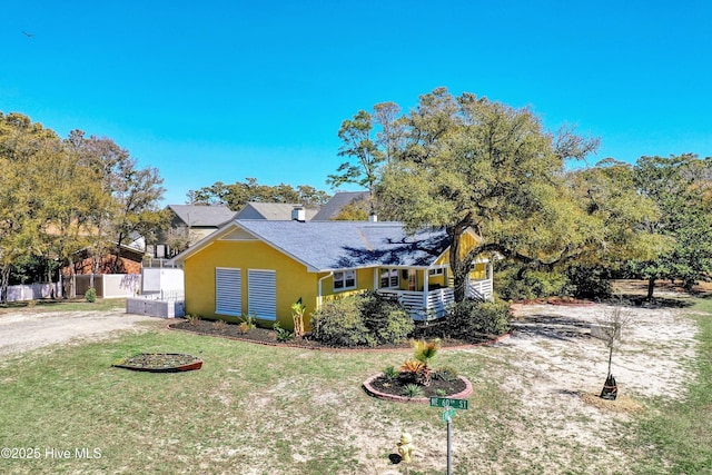 302 NE 60th St, Oak Island, NC 28465 - view of front facade with roof with shingles