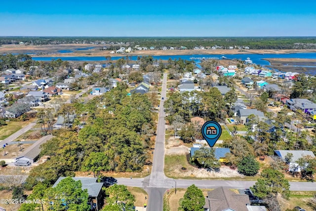 302 NE 60th St, Oak Island, NC 28465 - aerial overview of property's location featuring a nearby body of water and nearby suburban area