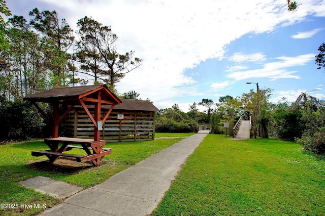 302 NE 60th St, Oak Island, NC 28465 - view of community with a yard and driveway