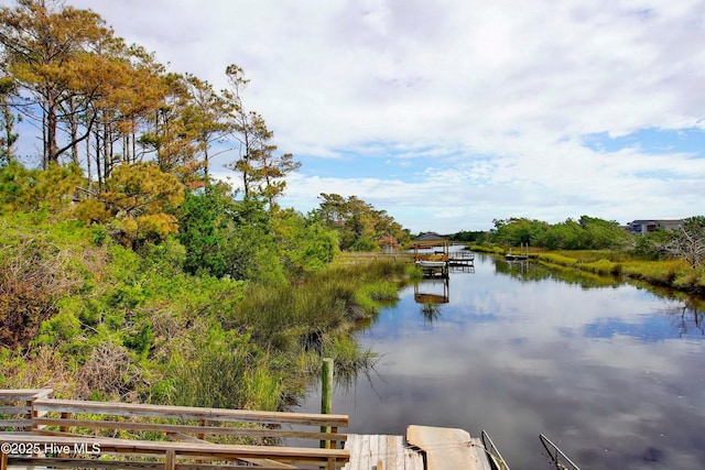 302 NE 60th St, Oak Island, NC 28465 - dock area featuring a water view