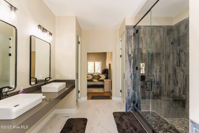 86 Sakonnet Trl, Pinehurst, NC 28374 - ensuite bathroom with marble look tiles, baseboards, a stall shower, and double vanity