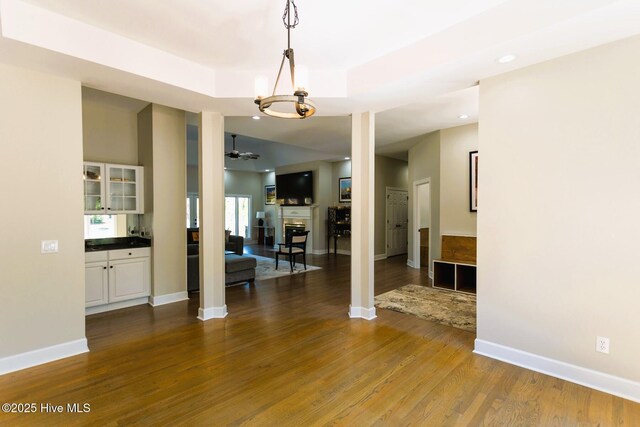 86 Sakonnet Trl, Pinehurst, NC 28374 - unfurnished dining area featuring wood finished floors, baseboards, ceiling fan, recessed lighting, and a fireplace