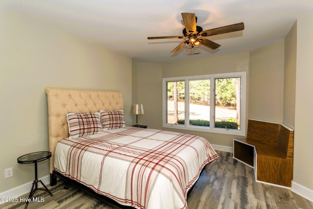 86 Sakonnet Trl, Pinehurst, NC 28374 - bedroom featuring baseboards, wood finished floors, and a ceiling fan