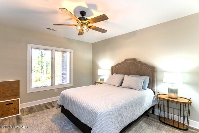 86 Sakonnet Trl, Pinehurst, NC 28374 - bedroom with baseboards, wood finished floors, and a ceiling fan