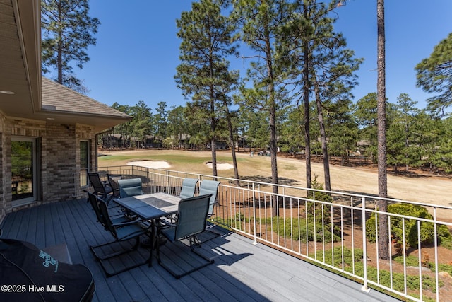 86 Sakonnet Trl, Pinehurst, NC 28374 - deck featuring outdoor dining space, golf course view, and view of wooded area