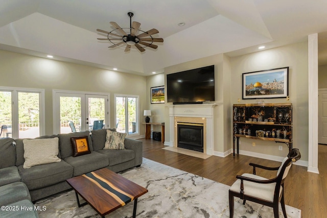 86 Sakonnet Trl, Pinehurst, NC 28374 - living area with a ceiling fan, wood finished floors, a fireplace with flush hearth, french doors, and vaulted ceiling