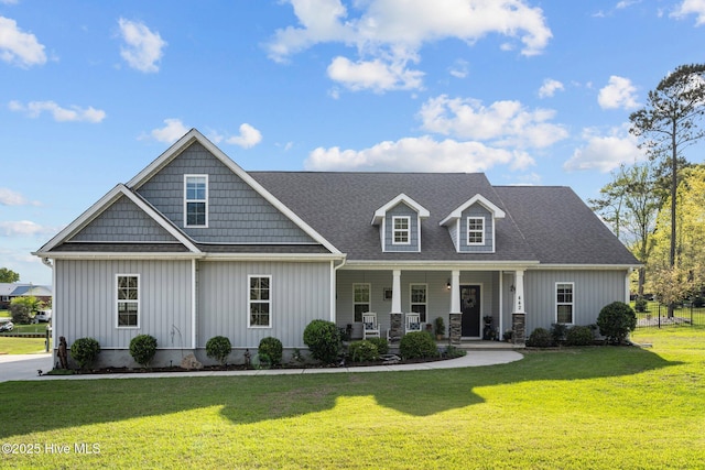 442 Crows Nest Ln, Sneads Ferry, NC 28460 - view of front facade featuring a porch, a front yard, and board and batten siding