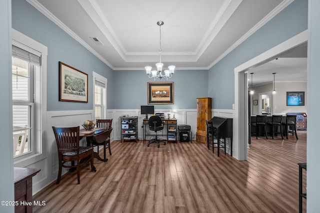 442 Crows Nest Ln, Sneads Ferry, NC 28460 - office space featuring wood finished floors, a chandelier, a tray ceiling, wainscoting, and crown molding
