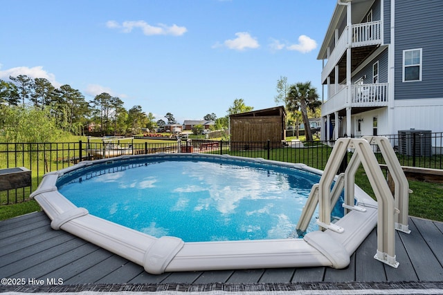 442 Crows Nest Ln, Sneads Ferry, NC 28460 - view of swimming pool featuring central AC and a wooden deck