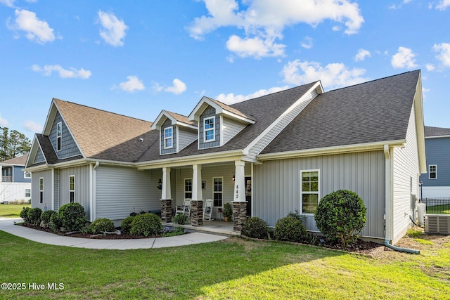 442 Crows Nest Ln, Sneads Ferry, NC 28460 - cape cod home with central AC unit, covered porch, a shingled roof, and board and batten siding