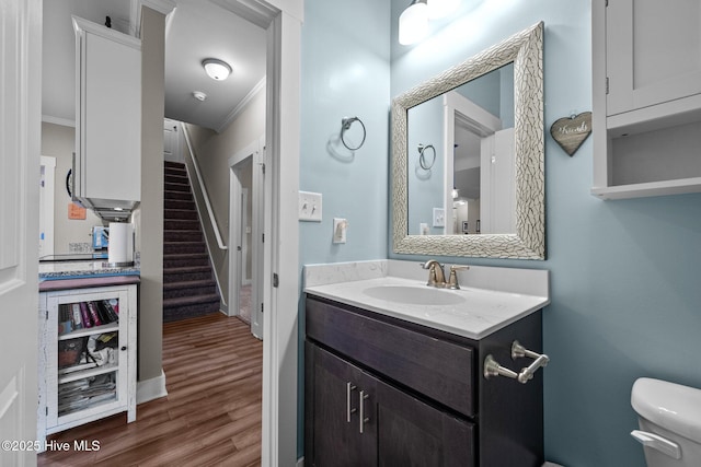 442 Crows Nest Ln, Sneads Ferry, NC 28460 - half bathroom featuring vanity, crown molding, toilet, and wood finished floors
