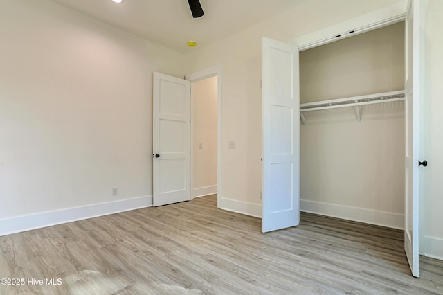 2967 Lake Pointe Dr SW, Supply, NC 28462 - unfurnished bedroom with baseboards, light wood-style floors, and a closet