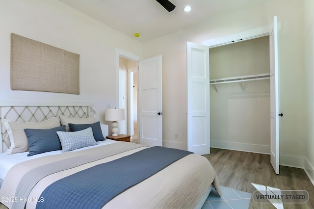 2967 Lake Pointe Dr SW, Supply, NC 28462 - bedroom with baseboards, a ceiling fan, wood finished floors, and a closet