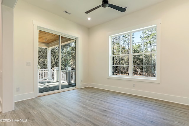 2967 Lake Pointe Dr SW, Supply, NC 28462 - unfurnished room featuring baseboards, wood finished floors, visible vents, and a wealth of natural light
