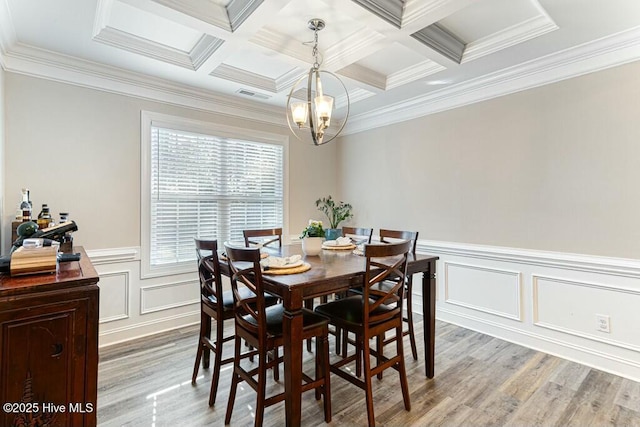 320 Thorne Rd, Pinehurst, NC 28374 - dining space featuring a chandelier, light wood-style flooring, a decorative wall, crown molding, and beamed ceiling