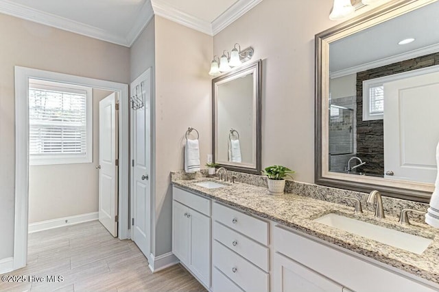 320 Thorne Rd, Pinehurst, NC 28374 - bathroom featuring tiled shower, wood finished floors, crown molding, baseboards, and double vanity