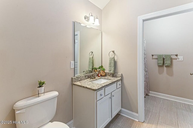320 Thorne Rd, Pinehurst, NC 28374 - bathroom with toilet, baseboards, and vanity