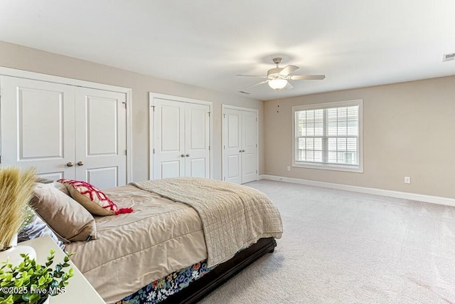 320 Thorne Rd, Pinehurst, NC 28374 - bedroom featuring baseboards, two closets, light colored carpet, and ceiling fan
