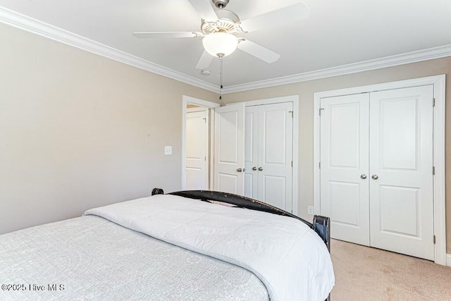 320 Thorne Rd, Pinehurst, NC 28374 - bedroom featuring two closets, light colored carpet, crown molding, and a ceiling fan