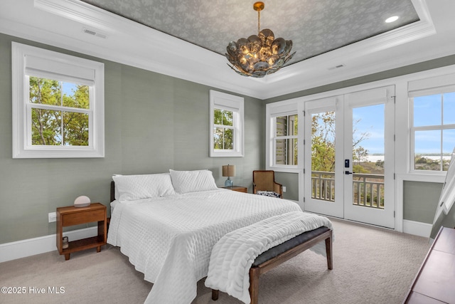 bedroom with access to outside, baseboards, carpet flooring, french doors, and a tray ceiling