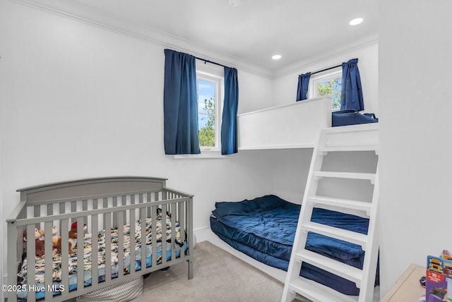 bedroom featuring ornamental molding, multiple windows, carpet flooring, and recessed lighting