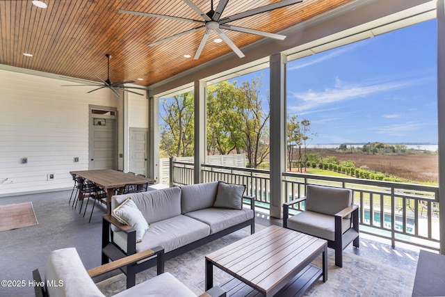 sunroom with an outdoor hangout area and ceiling fan